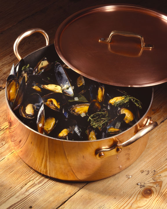 copper pot filled with mussels